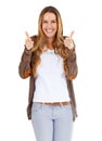 Hey, thats top notch. Portrait of an attractive young woman showing the gun sign to the camera. Royalty Free Stock Photo