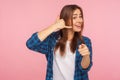 Hey you, call me! Portrait of happy flirtatious beautiful girl smiling playfully and pointing to camera