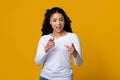 Hey You. Cheerful young black lady pointing fingers at camera Royalty Free Stock Photo