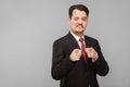 Man in suit pointing finger at camera and wink Royalty Free Stock Photo