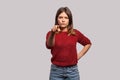 Hey you! Portrait of angry bossy woman in shaggy sweater pointing finger to camera, looking with suspicion