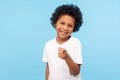 Hey you! Portrait of cheerful funny little boy with curly hair pointing finger to camera and smiling, child making choice Royalty Free Stock Photo