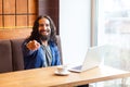 Hey you! Portrait of happy handsome young adult man freelancer in casual style sitting in cafe, pointing finger, looking at camera