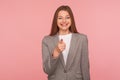 Hey you! Portrait of happy optimistic young woman in business suit making choice with indicating finger Royalty Free Stock Photo