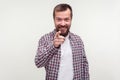 Hey you! Portrait of joyous bearded man pointing finger at camera and looking happy and cheerful.  on white background Royalty Free Stock Photo