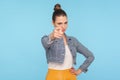 Hey, are you ready? Portrait of bossy strict lady with hair bun in fashionable clothes pointing finger to camera