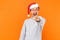 Hey you! It`s new year! Attractive man pointing finger at camera Royalty Free Stock Photo