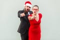 Hey you. Seriously businessman and woman looking at camera, pointing fingers and alert. Royalty Free Stock Photo