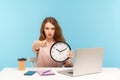 Hey you, time to work! Strict bossy serious woman, office employee sitting at workplace, pointing to camera