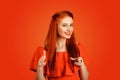 Woman redhead young woman pretty girl pointing at camera Royalty Free Stock Photo