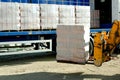 HGV delivered concrete blocks on construction site and telehandler offloading Royalty Free Stock Photo