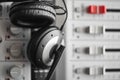 Hi-fi sound guard and noise reduction headphones over digital sound mixer Royalty Free Stock Photo