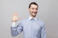 Hi, happy to see you. Portrait of funny handsome bristle businessman in classic light blue shirt standing, looking at camera and Royalty Free Stock Photo