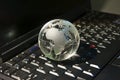 Hi-tech earth globe against fiber optic background