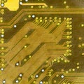 Hi-tech electronic circuit board golden texture Royalty Free Stock Photo