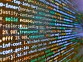 Hi-tech modern screen of data, digits and chars on monitor. Programming code abstract screen of software developer. Code on dark Royalty Free Stock Photo
