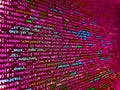 Hi-tech modern screen of data, digits and chars on monitor. Simple website HTML code with colorful tags in browser view on dark