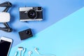 Hi tech travel gadget accessories on blue and pink copy space with drone action camera Royalty Free Stock Photo