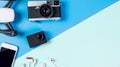 Hi tech travel gadget accessories on blue and pink copy space with drone action camera Royalty Free Stock Photo