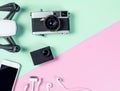 Hi tech travel gadget accessories on blue and pink copy space Royalty Free Stock Photo