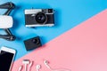 Hi tech travel gadget and accessories on blue and pink Royalty Free Stock Photo