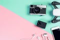 Hi tech travel gadget accessories on blue and pink Pastel copy space Royalty Free Stock Photo