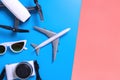 Hi tech travel gadget accessories on blue and pink yellow co Royalty Free Stock Photo