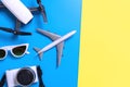 Hi tech travel gadget accessories on blue and pink yellow copy space Royalty Free Stock Photo