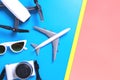 Hi tech travel gadget accessories on blue and pink yellow copy space Royalty Free Stock Photo