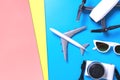 Hi tech travel gadget accessories on blue and pink yellow copy space Royalty Free Stock Photo