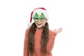 Hi there. Happy about new year. Christmas holiday. Small girl in santa hat. Happy child christmas tree eyewear accessory