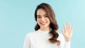 Hi what is up. Portrait of carefree friendly asian female entrepreneur, smiling broadly while waving raised palm
