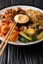 Hibachi fried rice with egg, shrimp, steak and vegetables close-up in a plate. vertical Royalty Free Stock Photo