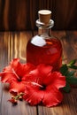 Hibiscus essential oil in a bottle. Generative AI, Royalty Free Stock Photo