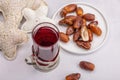 Hibiscus hot tea with dates. Traditional Ramadan Kareem concept snack for Iftar or Suhoor meal