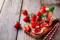 Hibiscus strawberry rhubarb iced tea with mint. Ice cold summer cocktail or lemonade in mason jar Royalty Free Stock Photo