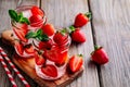 Hibiscus strawberry rhubarb iced tea with mint. Ice cold summer cocktail or lemonade in mason jar Royalty Free Stock Photo