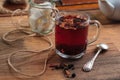 Hibiscus tea with fruit pieces and sugar in glass Royalty Free Stock Photo
