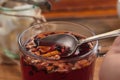 Hibiscus tea with fruit pieces and sugar in glass Royalty Free Stock Photo