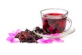 Hibiscus tea in glass cup among the rose petals and dry petals. Royalty Free Stock Photo