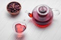 Hibiscus tea in glass teapot and cup Royalty Free Stock Photo