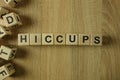 Hiccups word from wooden blocks