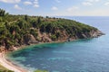Hidden bay from the eyes of ordinary travelers, with a narrow strip of white sand and full of repose and bliss, Sithonia,