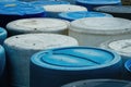 Barrels of blue and white on park land Royalty Free Stock Photo