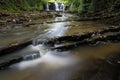 Hidden cascading waterfall in a deep gorge with trickling white water. Forest of Bowland, Ribble Valley, Lancashire Royalty Free Stock Photo