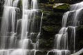 Hidden cascading waterfall in a deep gorge with trickling white water. Forest of Bowland, Ribble Valley, Lancashire Royalty Free Stock Photo