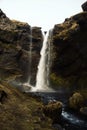 Hidden cliff grass moss landscape canyon gorge waterfall Kvernufoss river near Skogafoss South Iceland Europe Royalty Free Stock Photo