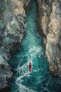 In a hidden cove, kayakers navigate treacherous waters, their paddles slicing through the waves with precision.