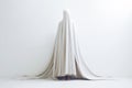 Hidden Depression Concept. Woman Covered with a White Sheet Like a Ghost on a White Background. Generative AI