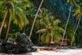 Hidden hut and boat on Ipil Beach at Pinagbuyutan Island. El Nido, Palawan, Philippines